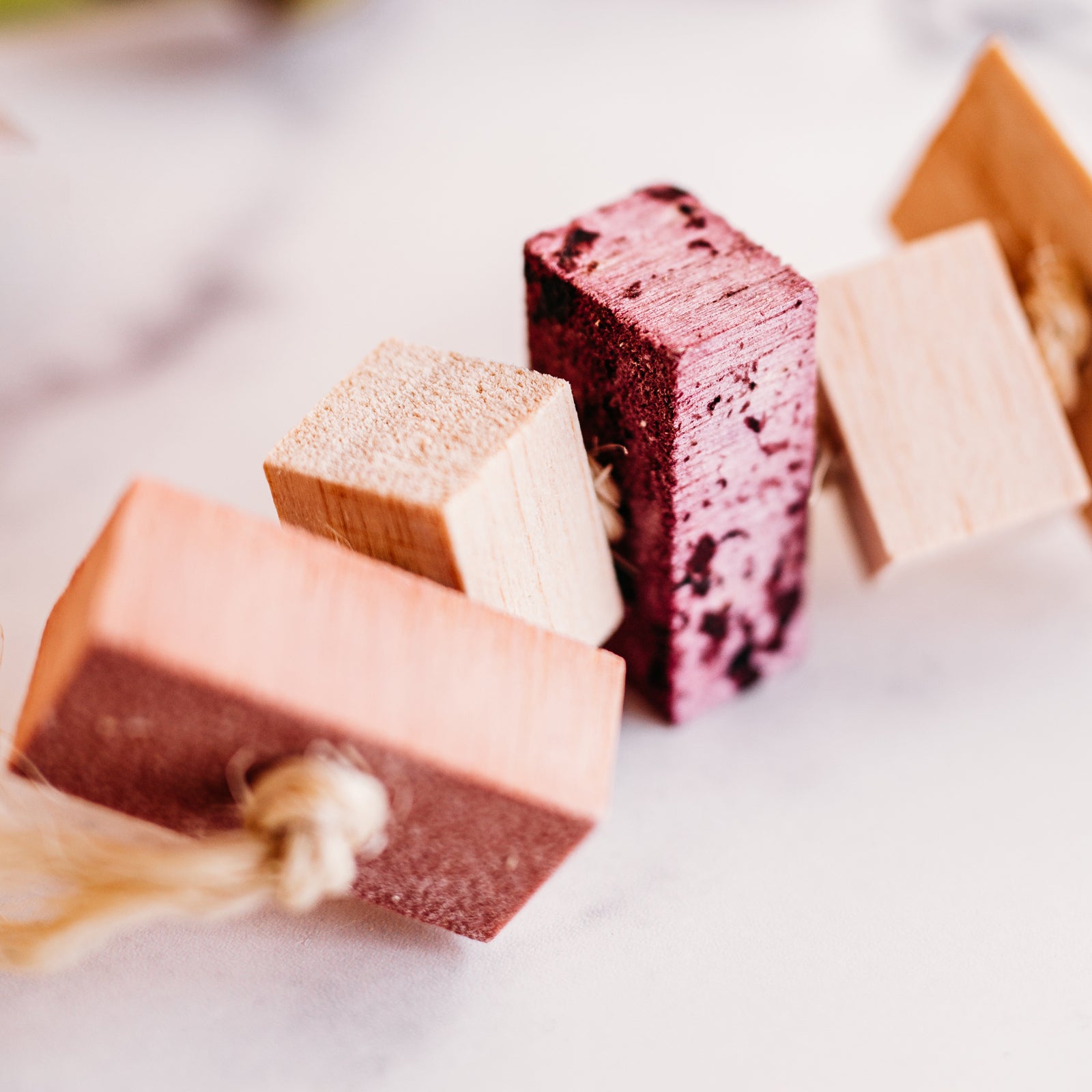 Close up of all natural Fruit Balsa Fling toy for small pets.